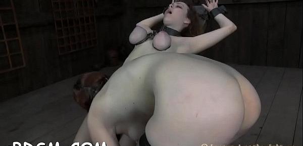  Beauty gets her pussy gratified while inside a cage